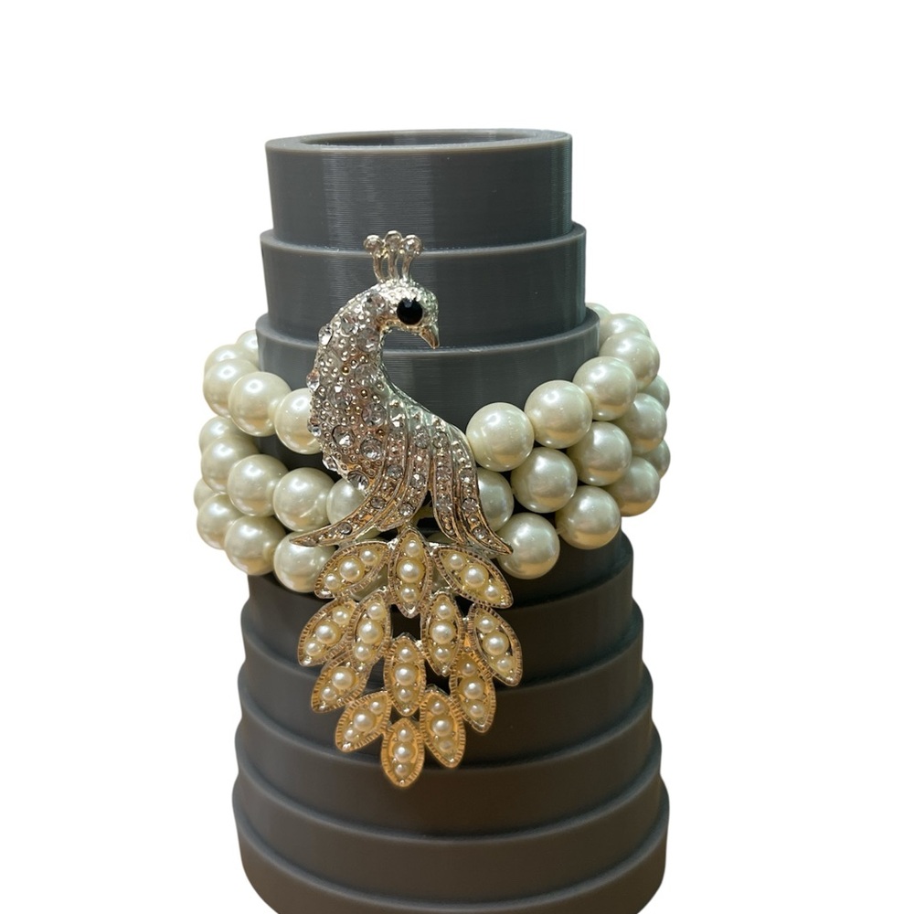 137 Elegant Pearl and Silver Peacock Bracelet